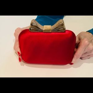 A clutch bag with available strap.